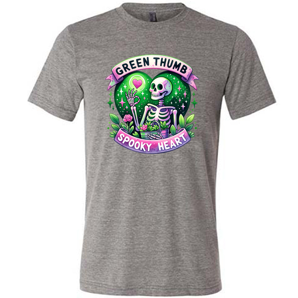 Grey colored shirt with a skeleton and plants graphic on it that says "Green Thumb Spooky Heart"