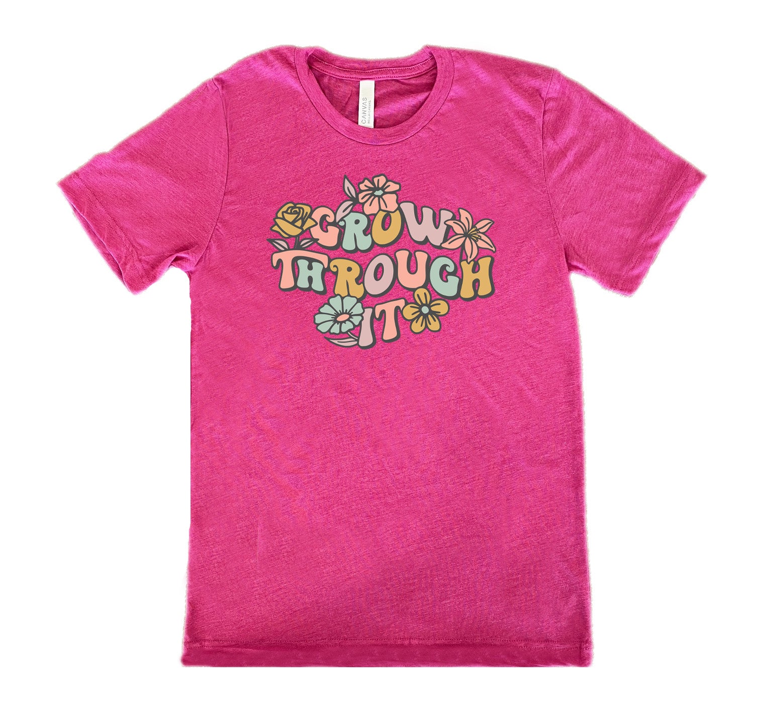 Berry colored shirt with a flower graphic on it that says "Grow Through It"
