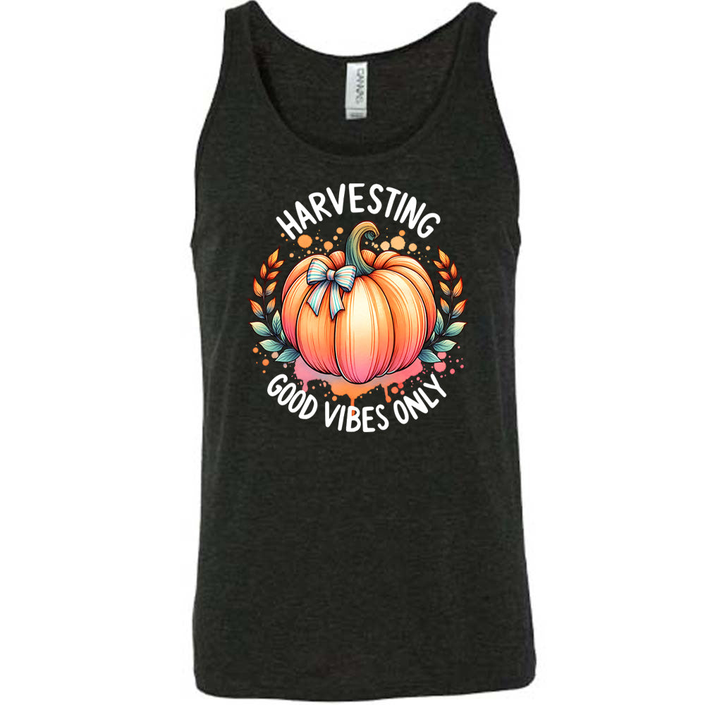 Black colored tank with pumpkin graphic on it that says "Harvesting Good Vibes Only"