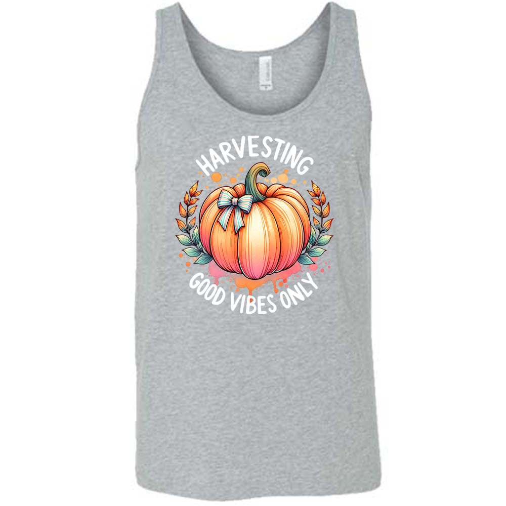 Grey colored tank with pumpkin graphic on it that says "Harvesting Good Vibes Only"