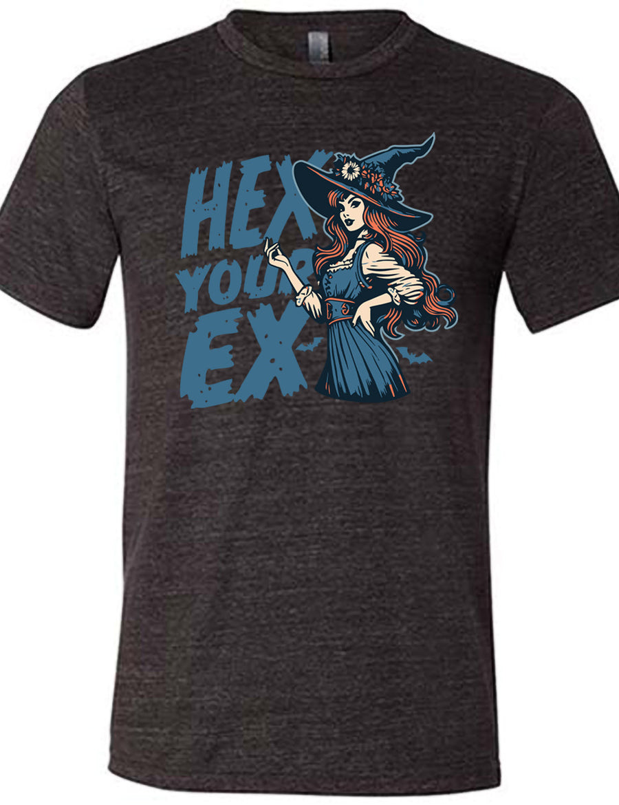 black unisex tee with the words "hex your ex" on it, next to the detailed, colorful graphic of a long-haired witch, hand on hip, other hand raised, wearing a flowery witch hat, and an old-fashioned dress