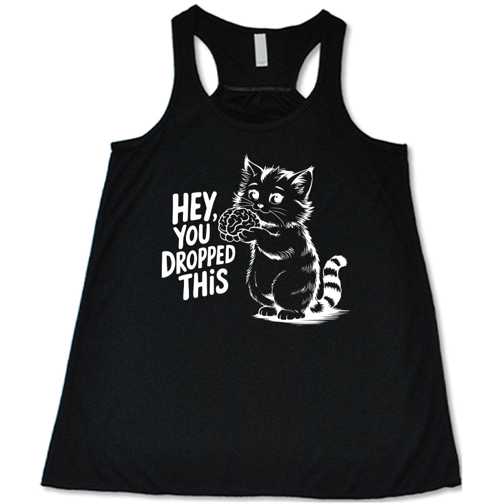 black flowy tank with the words "Hey, you dropped this" and the graphic of a racoon holding a brain