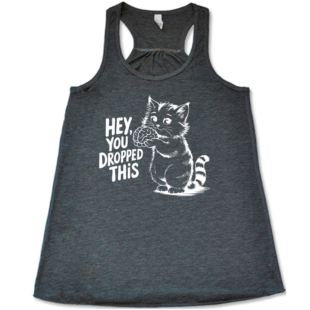 grey flowy tank with the words "Hey, you dropped this" and the graphic of a racoon holding a brain