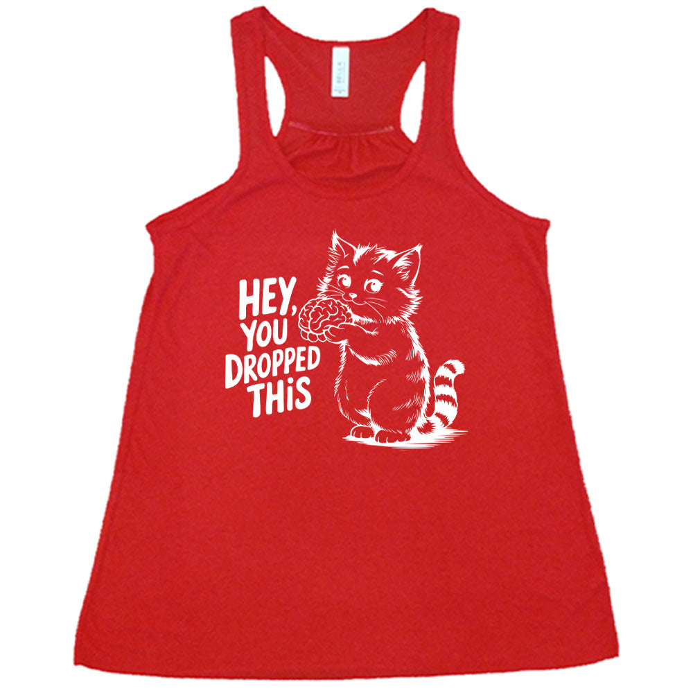 red flowy tank with the words "Hey, you dropped this" and the graphic of a racoon holding a brain