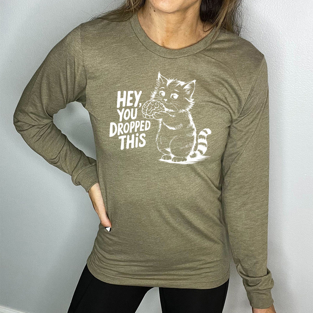 heather olive long sleeve with the words "Hey, you dropped this" and the graphic of a racoon holding a brain