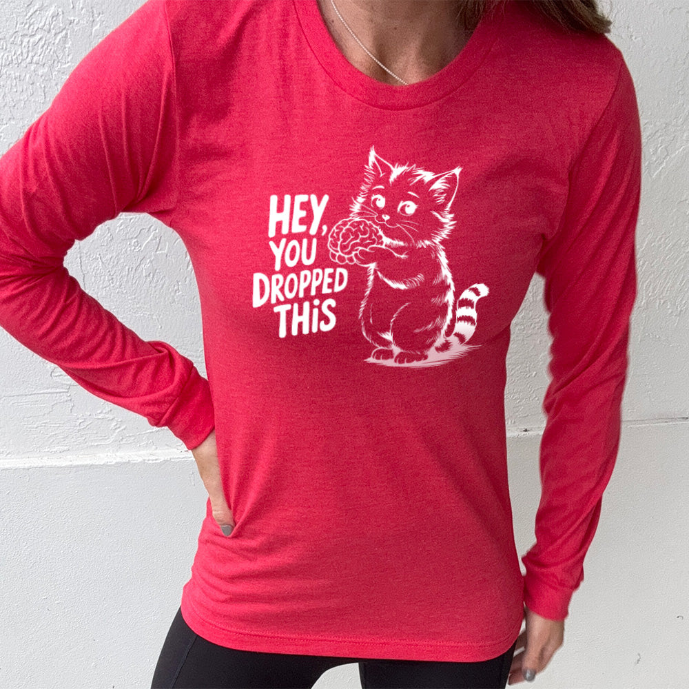 heather red long sleeve with the words "Hey, you dropped this" and the graphic of a racoon holding a brain
