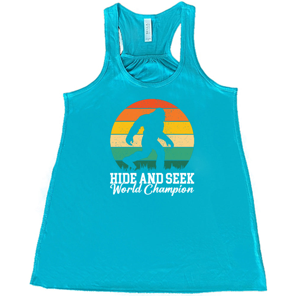teal shirt with the text "Hide And Seek World Champion" on it