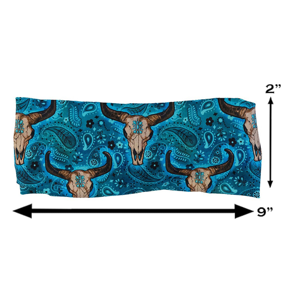 teal cow skull print headband measured at 2 by 9 inches