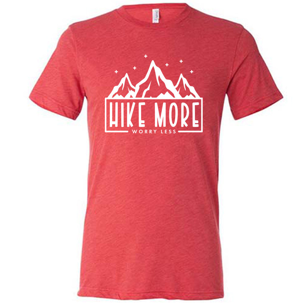 Red colored shirt with a mountains and stars graphic on it that says "Hike More Worry Less" 