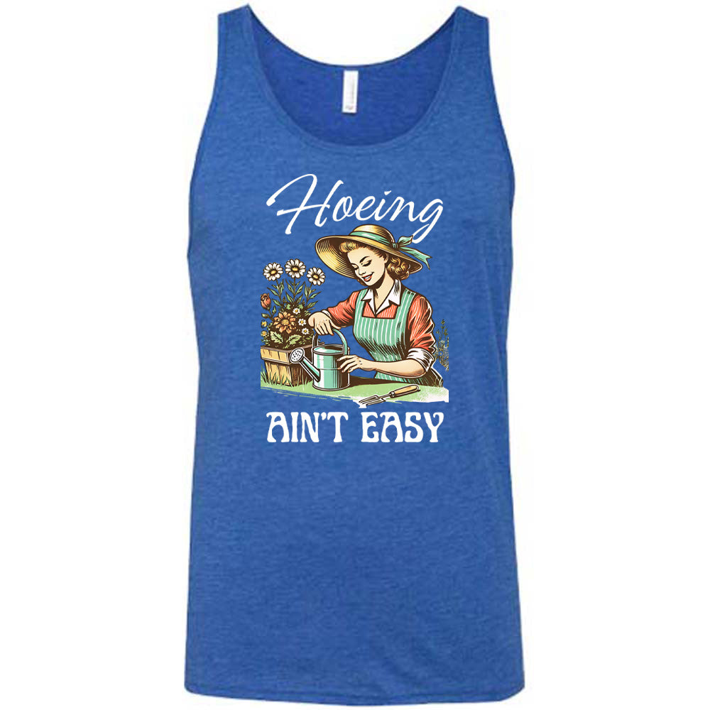 Blue colored tank with a woman gardening graphic on it that says "Hoeing Ain't Easy"