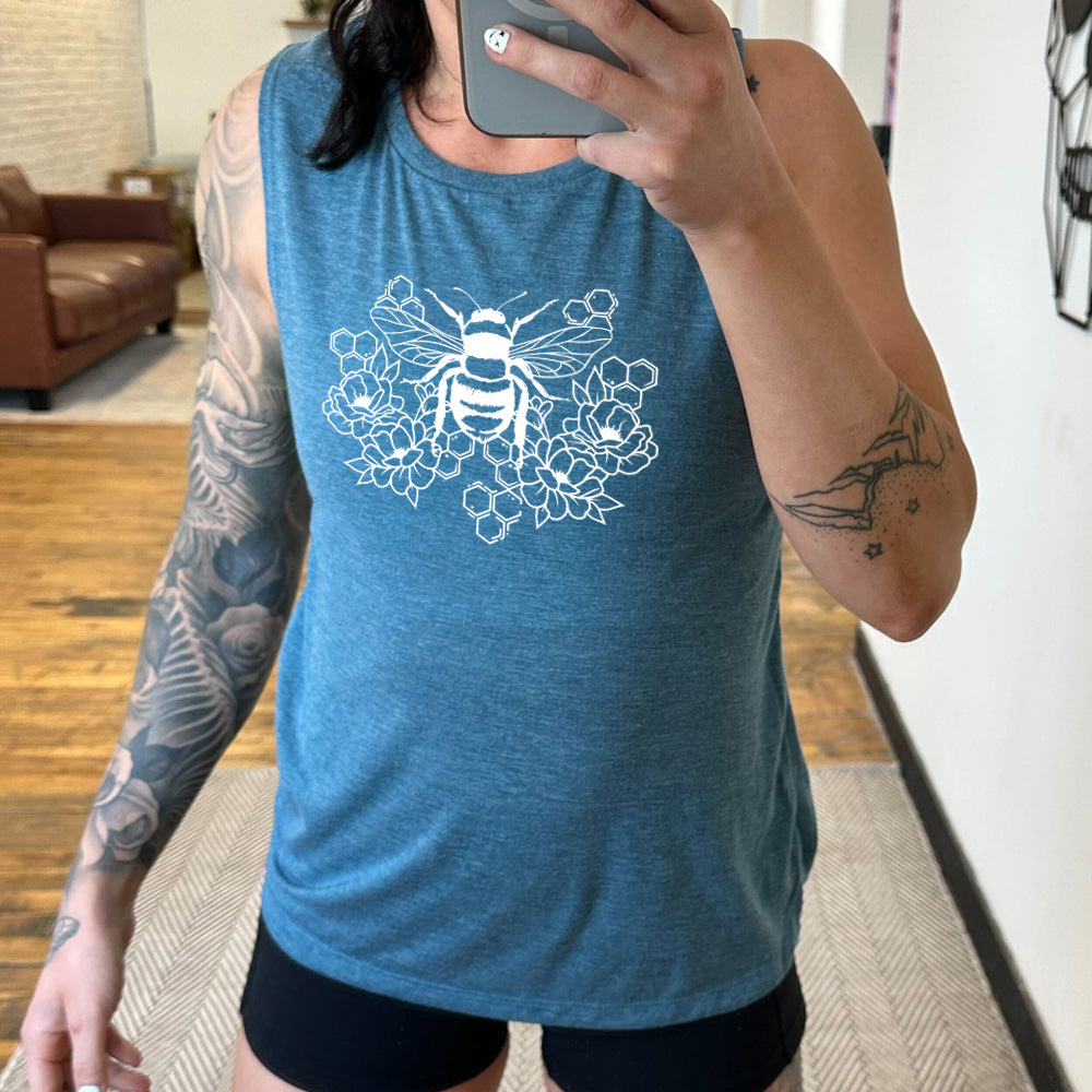 deep teal muscle tank with a bee, honeycomb, and flower graphic on it