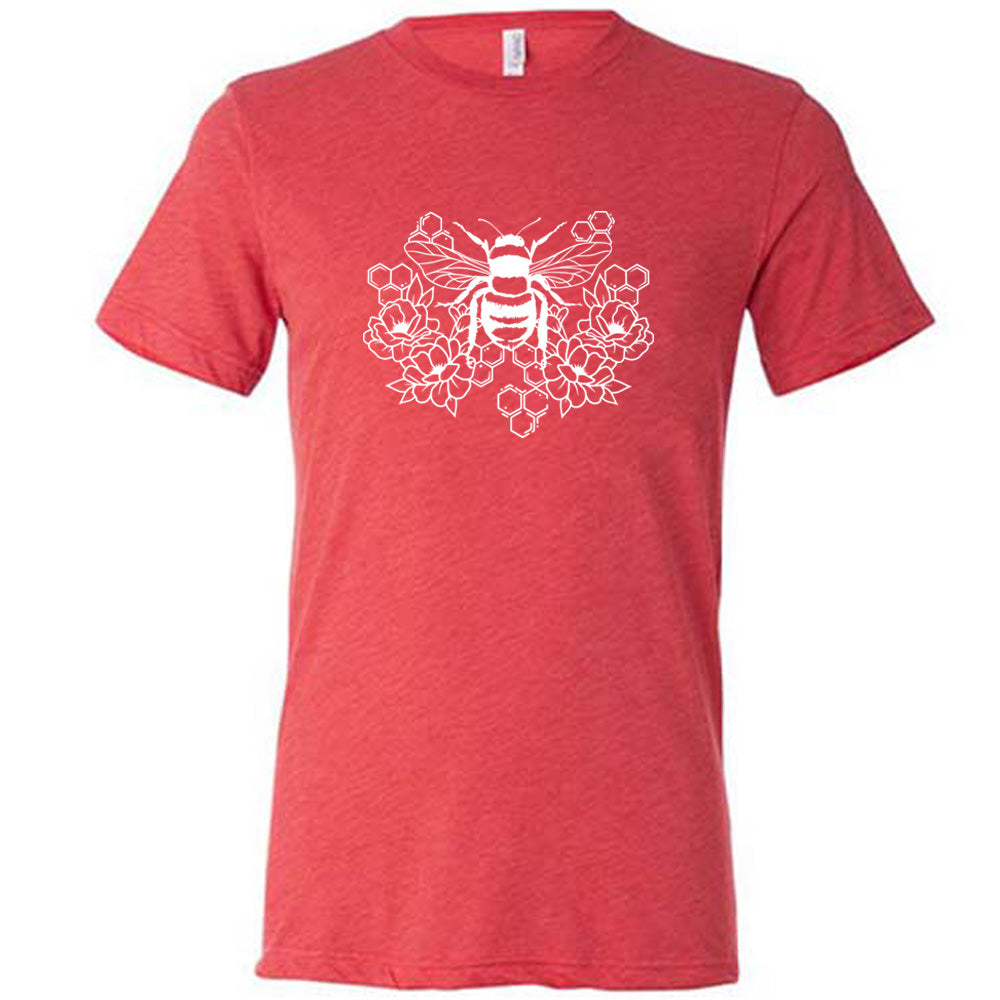 Red colored shirt with a bee, honeycomb, and flower graphic on it