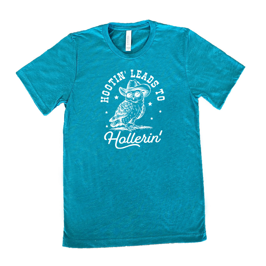 Teal colored shirt with owl in cowboy hat graphic on it that says "Hootin Leads To Hollerin"