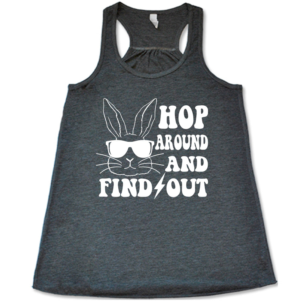 grey racerback tank with the words " hop around and find out" with the graphic of a bunny's face, wearing sunglasses, and a lightning bolt between the words "find" and "out"