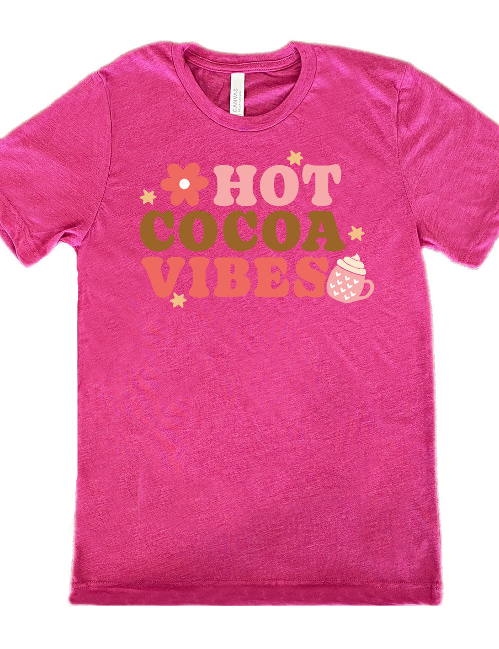 berry unisex tee with the colorful words saying "HOT COCOA VIBES" with small graphics of a flower and mug, with many hearts on it, topped with whipped cream, and a few stars