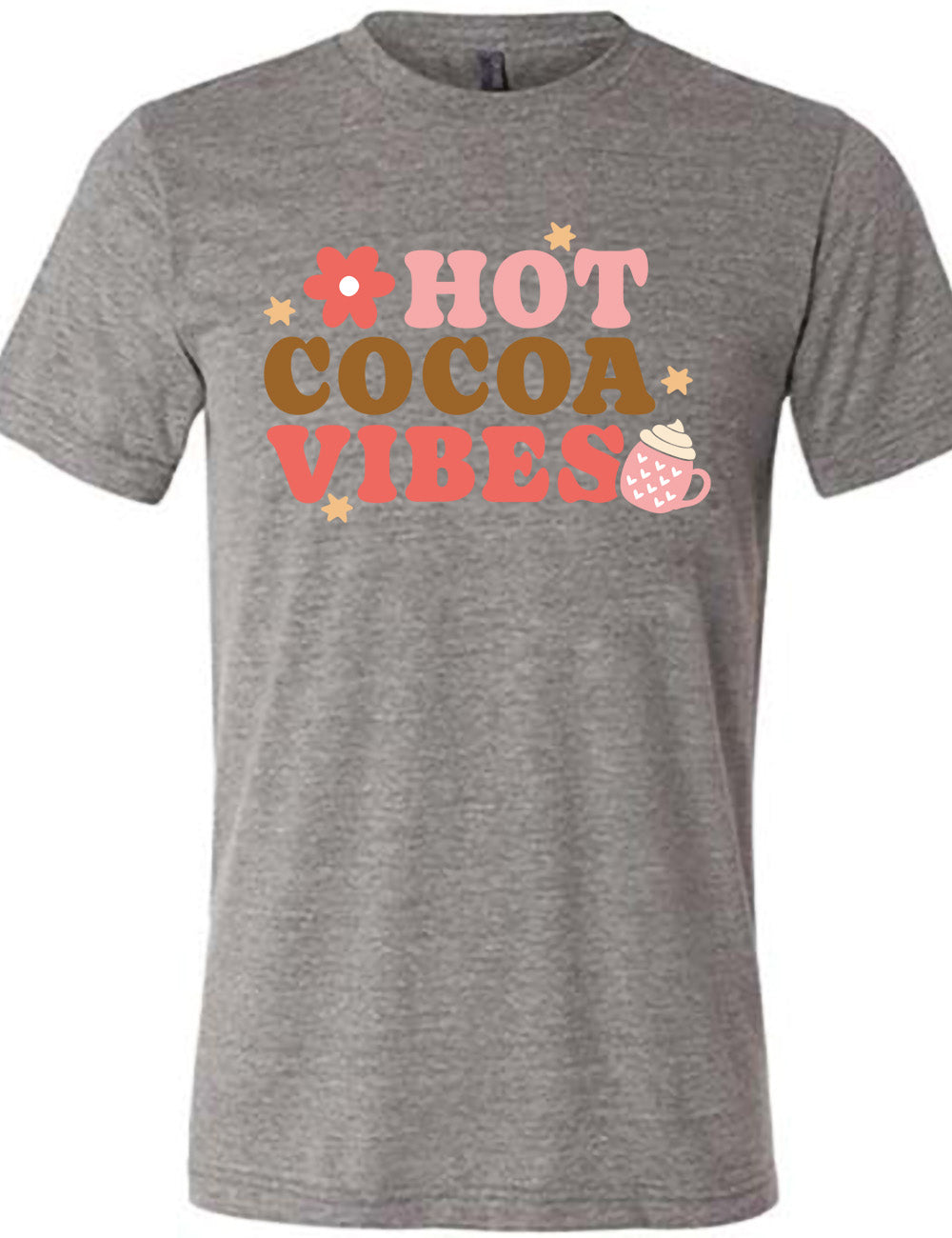 grey unisex tee with the colorful words saying "HOT COCOA VIBES" with small graphics of a flower and mug, with many hearts on it, topped with whipped cream, and a few stars