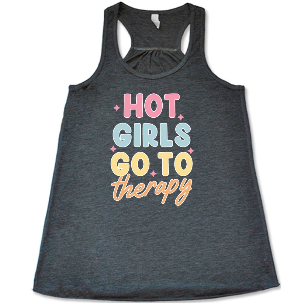 Grey colored flowy tank with a sparkle graphic on it that says "Hot Girls Go To Therapy"