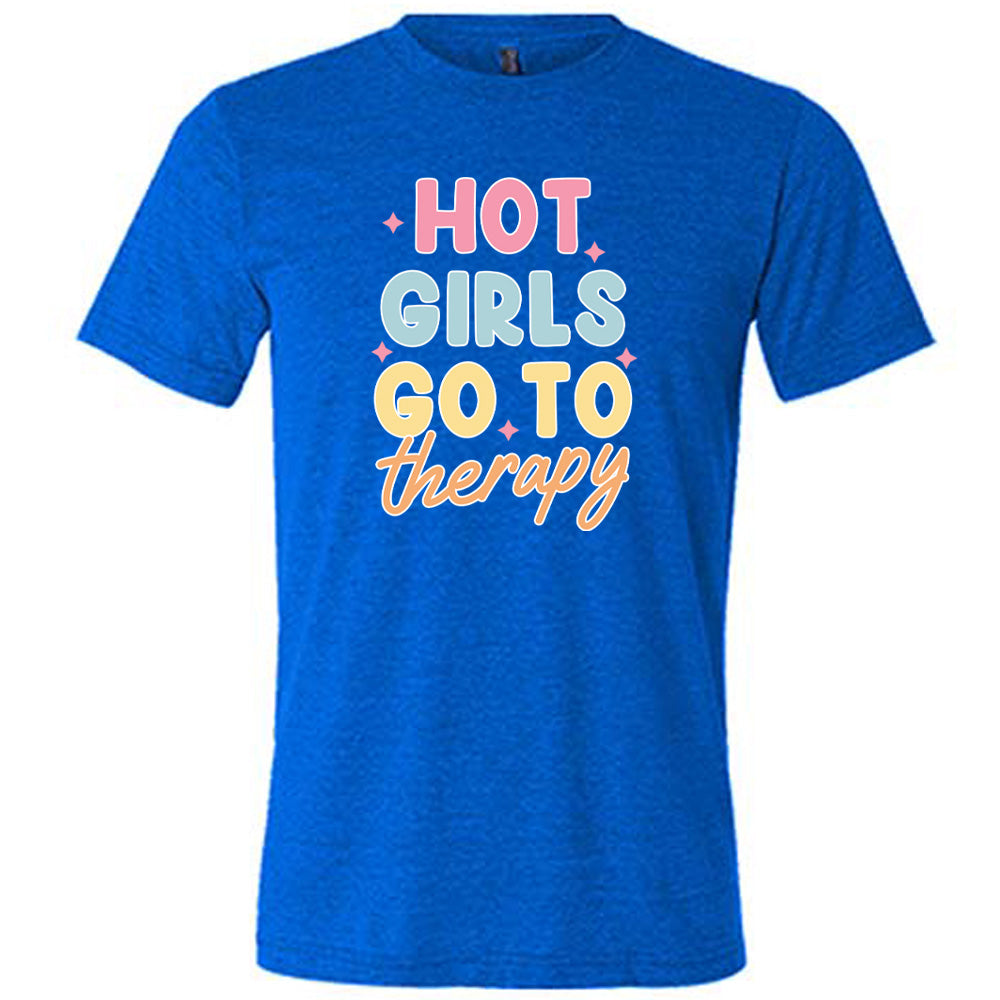 Blue colored shirt with a sparkle graphic on it that says "Hot Girls Go To Therapy"
