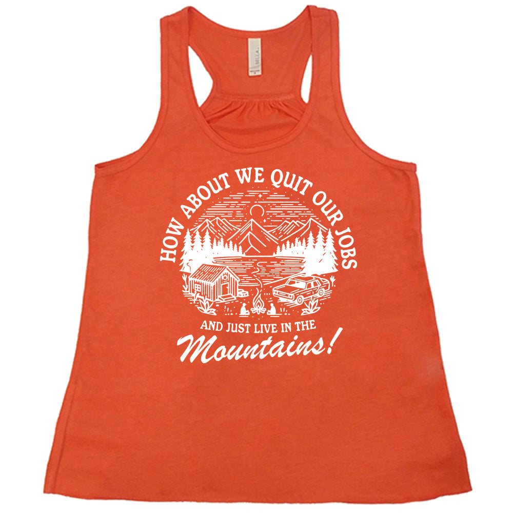 coral flowy tank with the words "How about we quit our jobs and just live in the mountains!" on it, with the graphic of a small house, a couple people sitting around a campfire, and an old car in the woods and mountains, with a sky and a couple stars and the moon