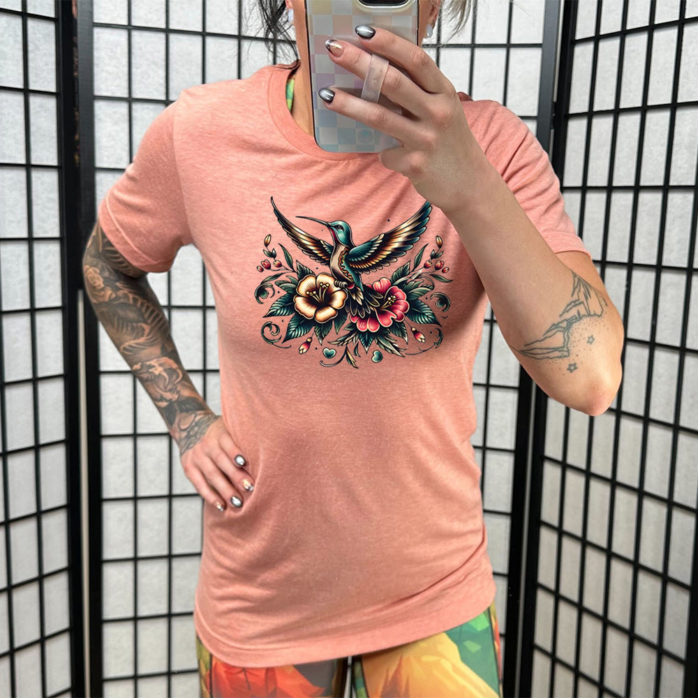 coral shirt with a hummingbird graphic on it