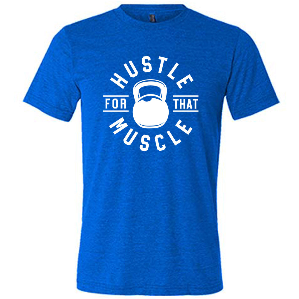 blue unisex tee with the words "hustle for that muscle" on it, with a kettlebell image