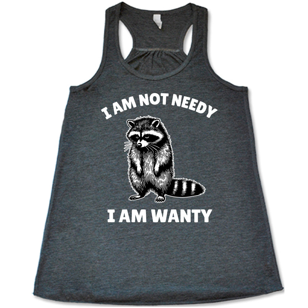 grey racerback flowy tank with the graphic of a raccoon, hanging its head and drooping its arms, and the words "I am not needy I am wanty" on it