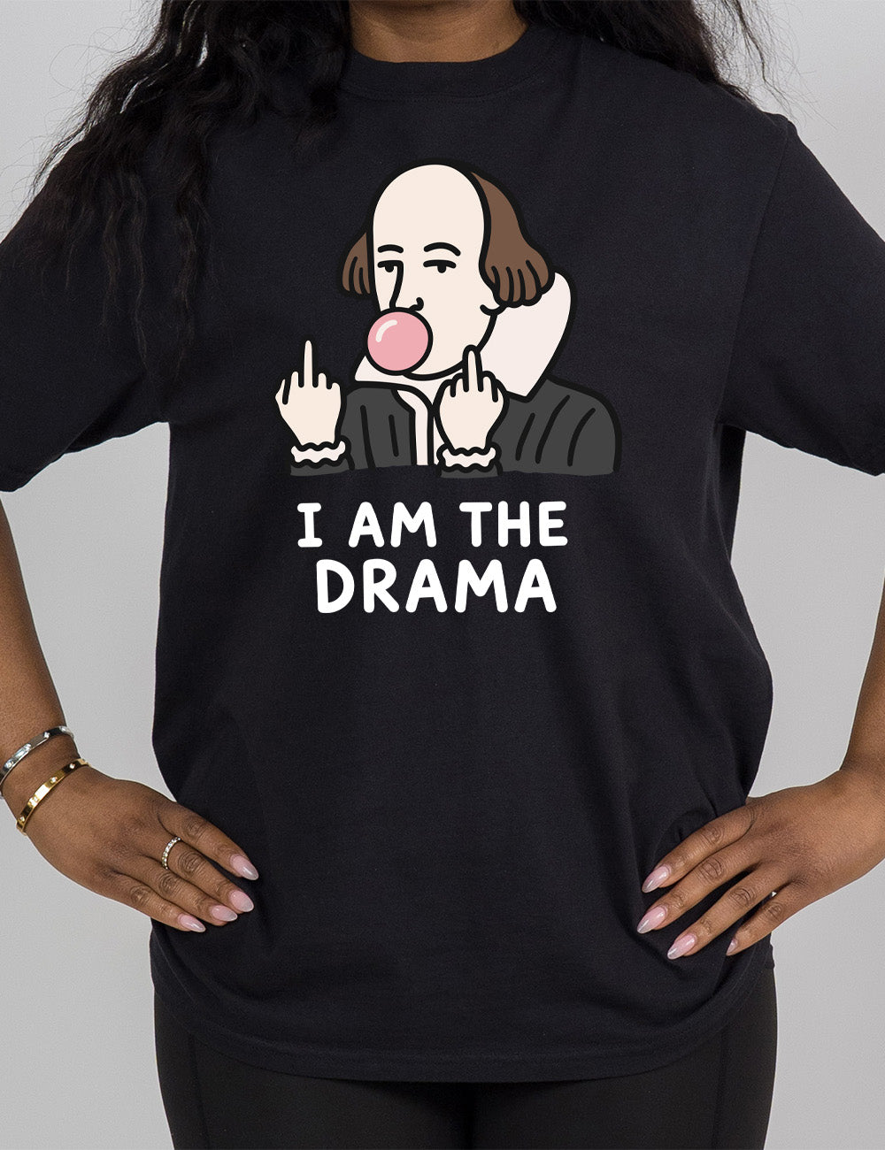 black modern tee with the graphic of Shakespeare, blowing a bubble of gum and giving two middle fingers, with words underneath saying "I AM THE DRAMA"