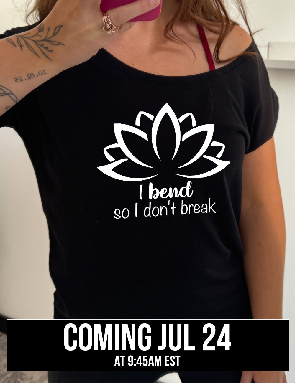 black slouchy tee with the graphic silhouette of a lotus and the words underneath saying "I bend so I don't break" coming july 24th