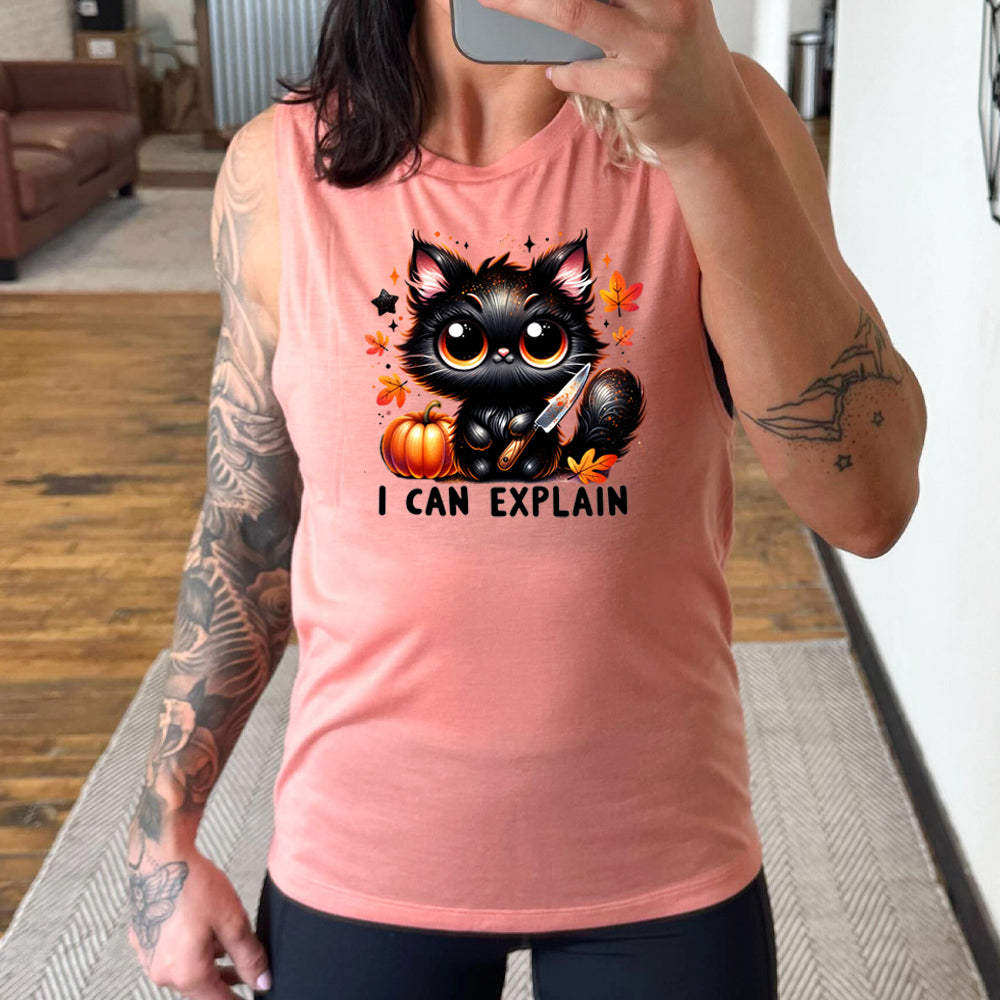 peach shirt with the text "I Can Explain" and a kitten with a knife graphic on it