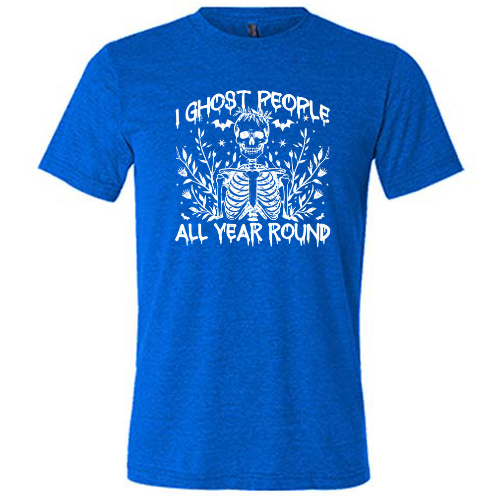 Blue colored shirt with skeleton and bats graphic on it that says "I Ghost People All Year Round"