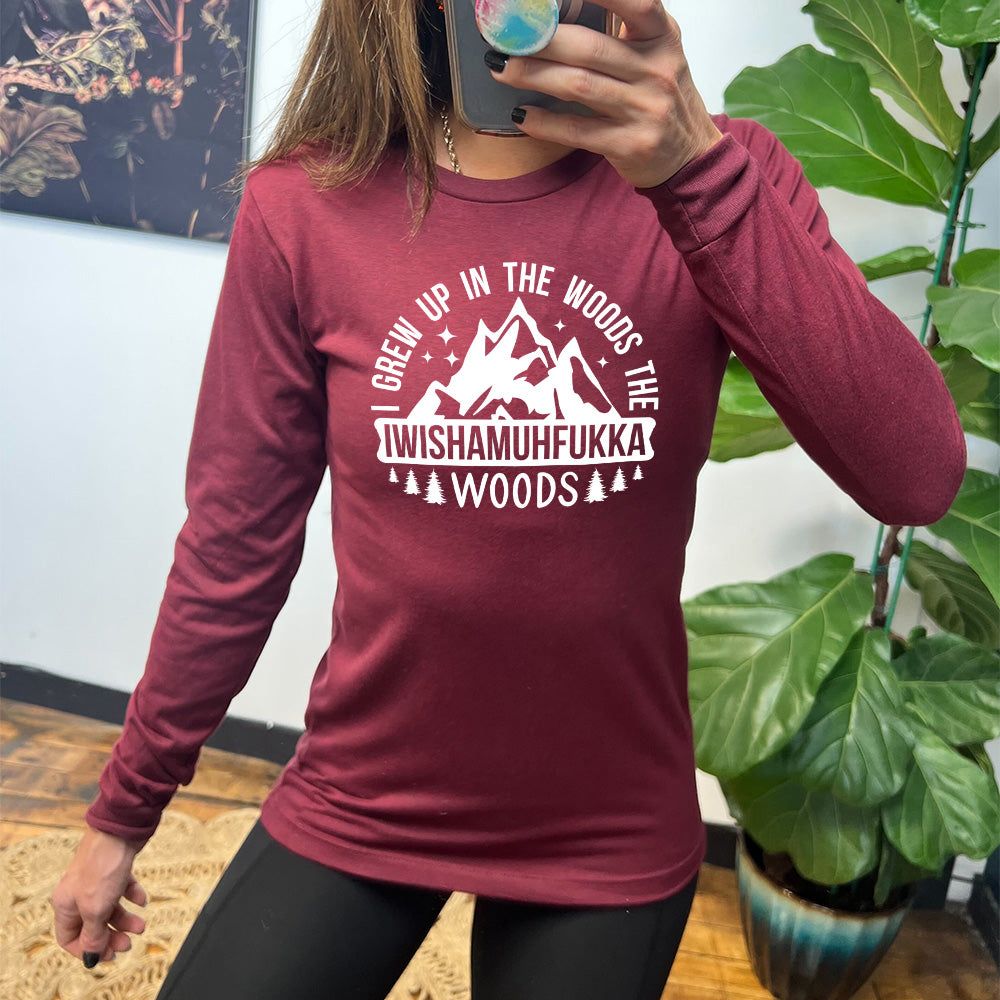 heather cardinal long sleeve with the words "I grew up in the woods the Iwishamuhfukka woods" on it, with the graphic of mountains and trees and stars