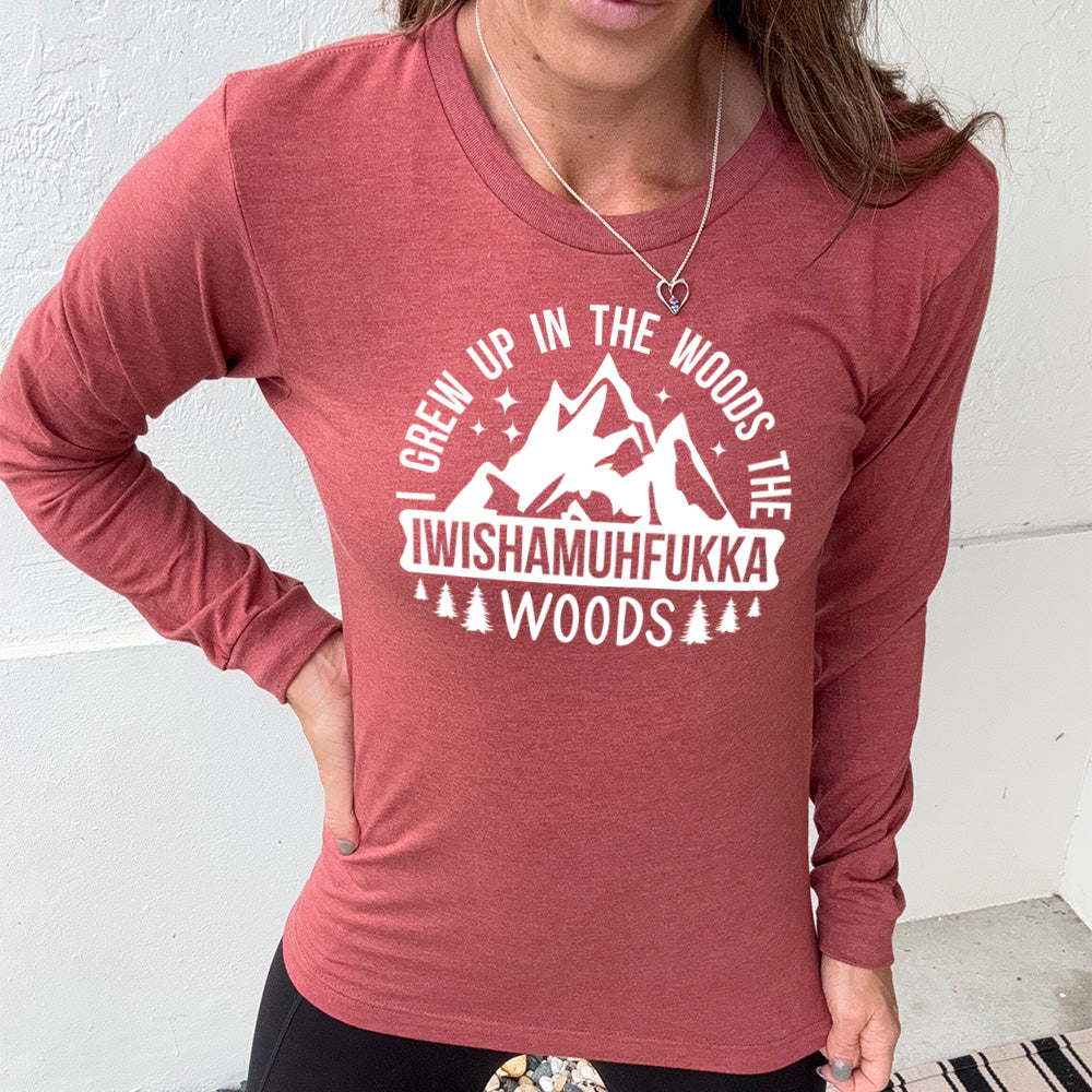 heather clay long sleeve with the words "I grew up in the woods the Iwishamuhfukka woods" on it, with the graphic of mountains and trees and stars