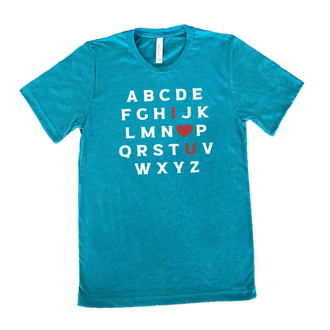 teal unisex tee with the alphabet on it in white lettering, but with the "I" in red, the "O" turned into a red heart, and "U" in red