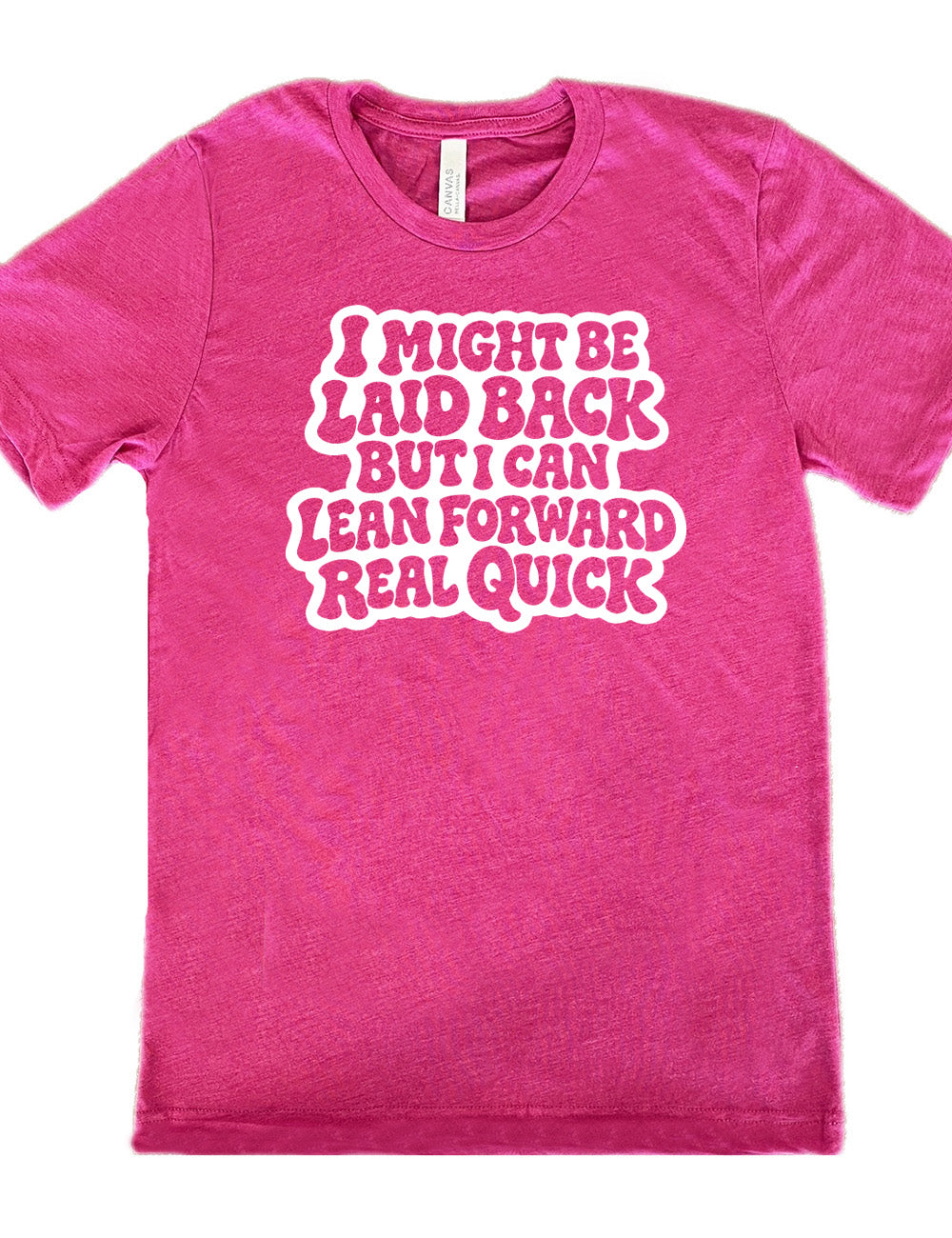 berry unisex tee with the words "I might be laid back but I can lean forward real quick" on it