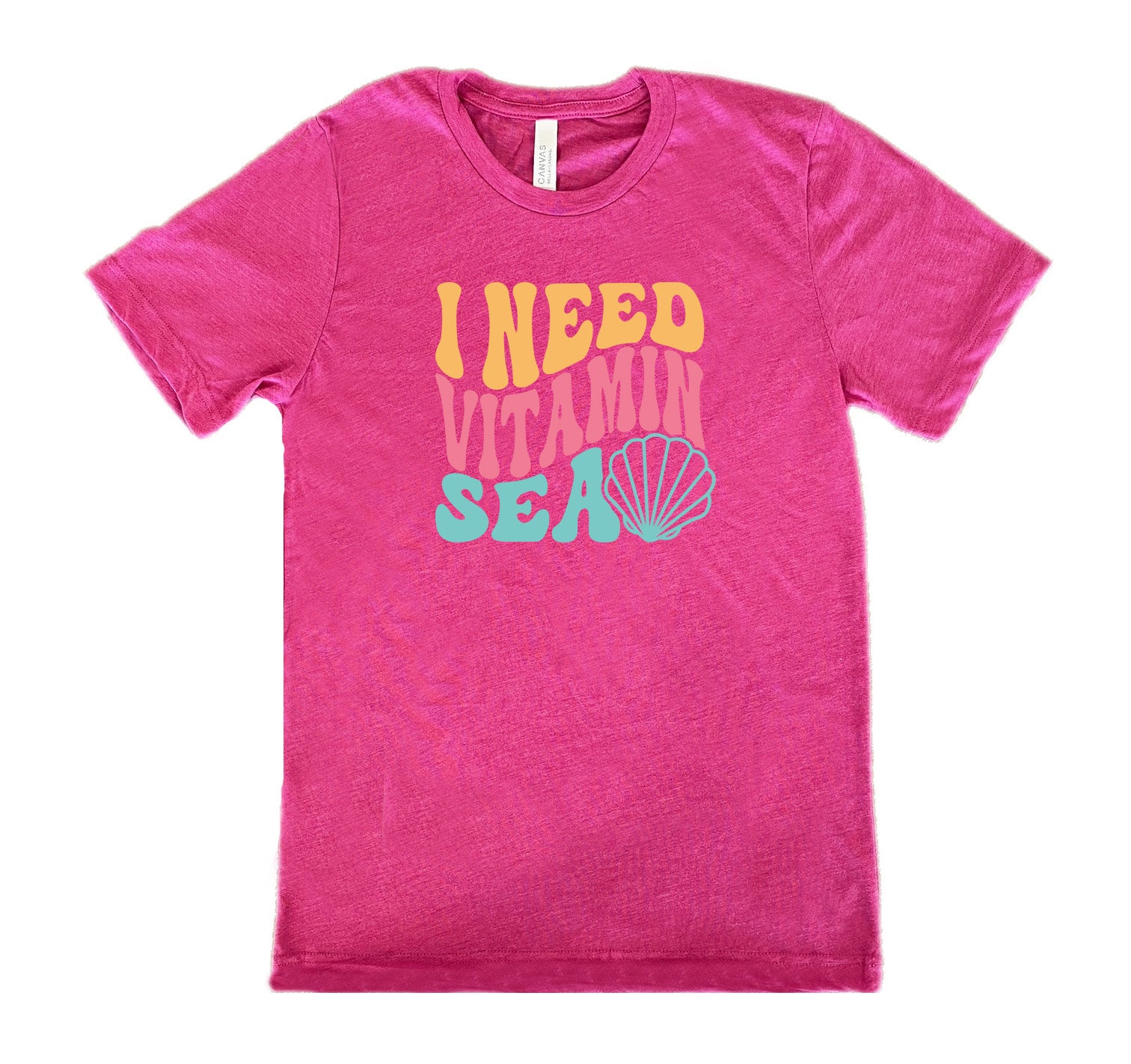 Berry colored shirt with a shell graphic on it that says "I Need Vitamin Sea" 