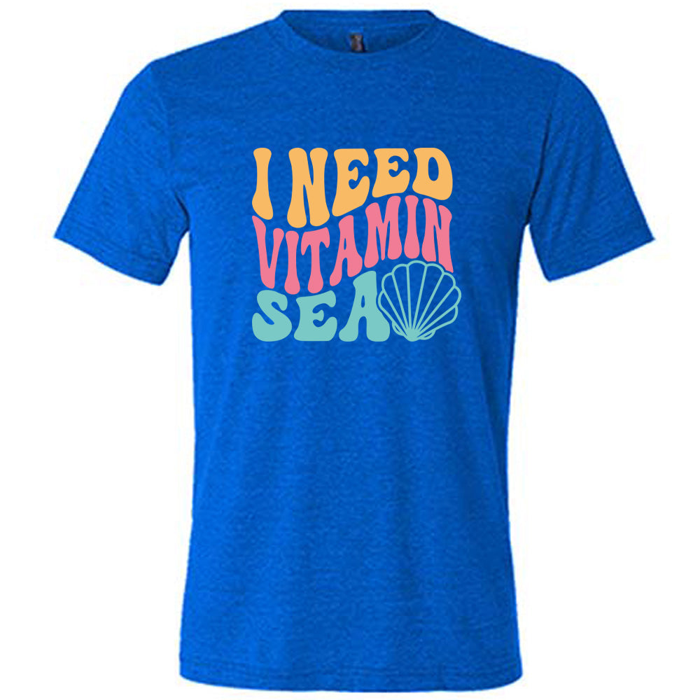 Blue colored shirt with a shell graphic on it that says "I Need Vitamin Sea" 
