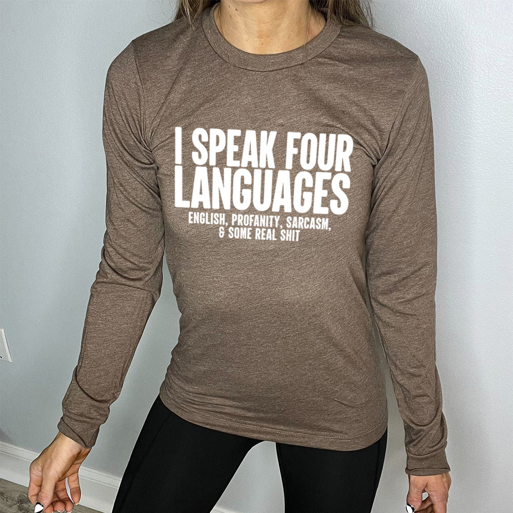 heather brown long sleeve shirt with the words "I speak four languages" in big letters, and smaller words underneath saying "English, profanity, sarcasm, & some real shit"