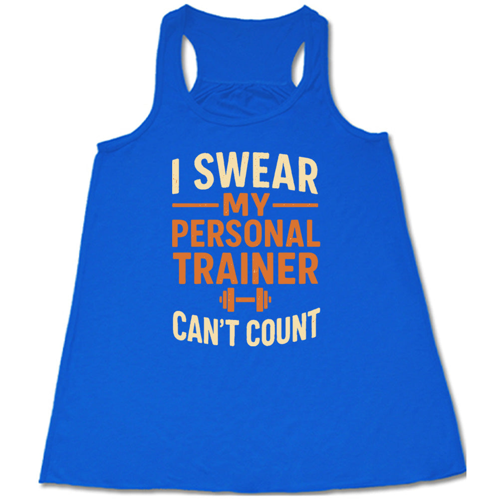 blue flowy tank with the words "I swear my personal trainer can't count" on it, and the small image of a barbell