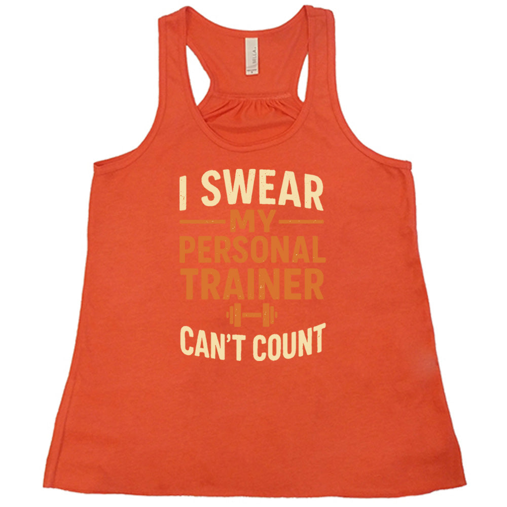 coral flowy tank with the words "I swear my personal trainer can't count" on it, and the small image of a barbell