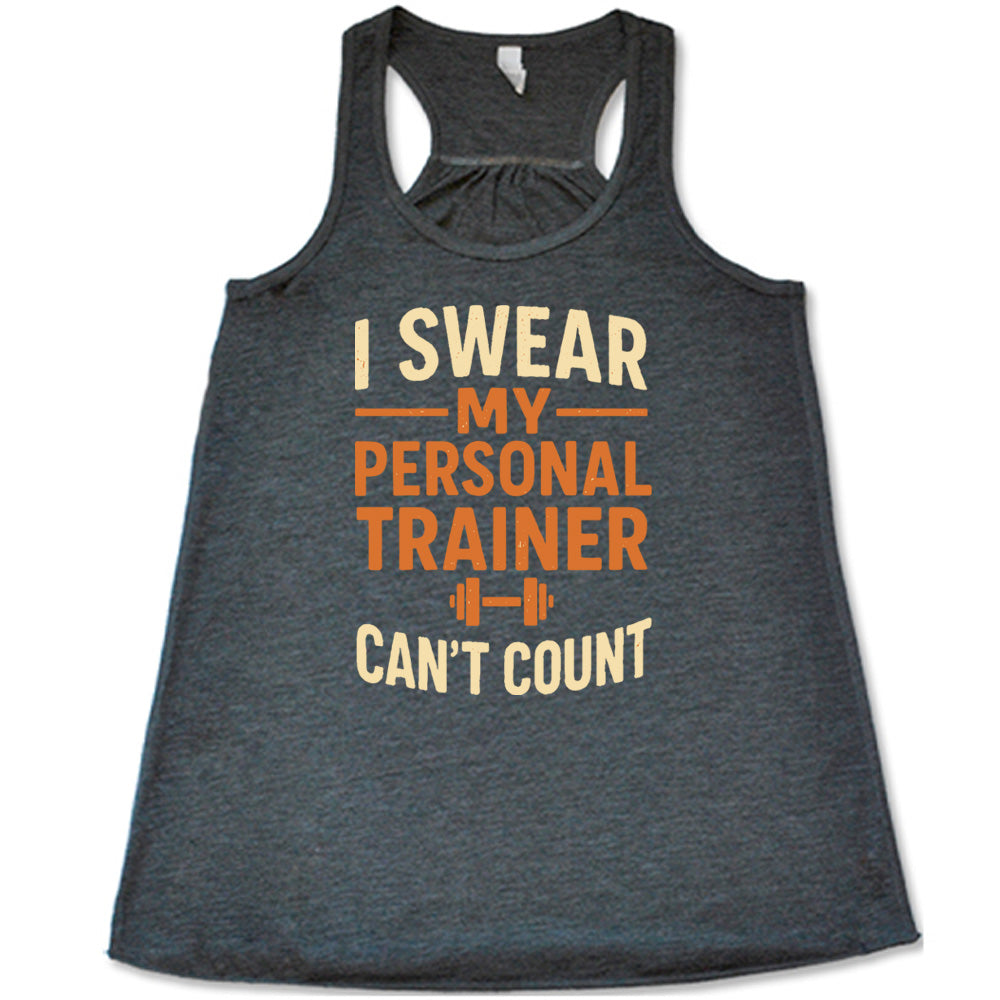 grey flowy tank with the words "I swear my personal trainer can't count" on it, and the small image of a barbell
