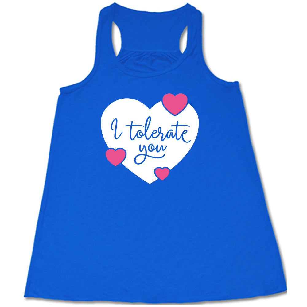 blue flowy tank with the words "I tolerate you" in blue lettering on it, within a white heart graphic that has three small pink hearts overlapping on its edges 