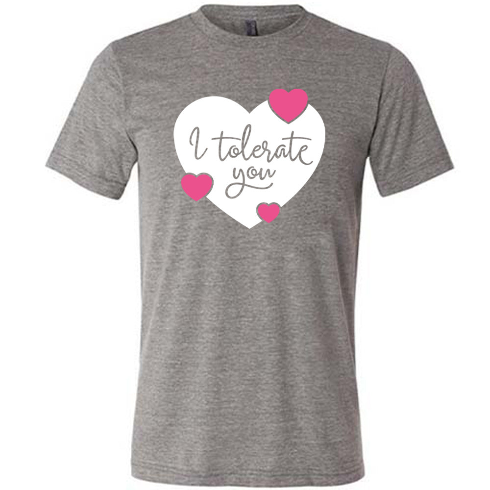 grey unisex tee with the words "I tolerate you" in grey lettering on it, within a white heart graphic that has three small pink hearts overlapping on its edges 