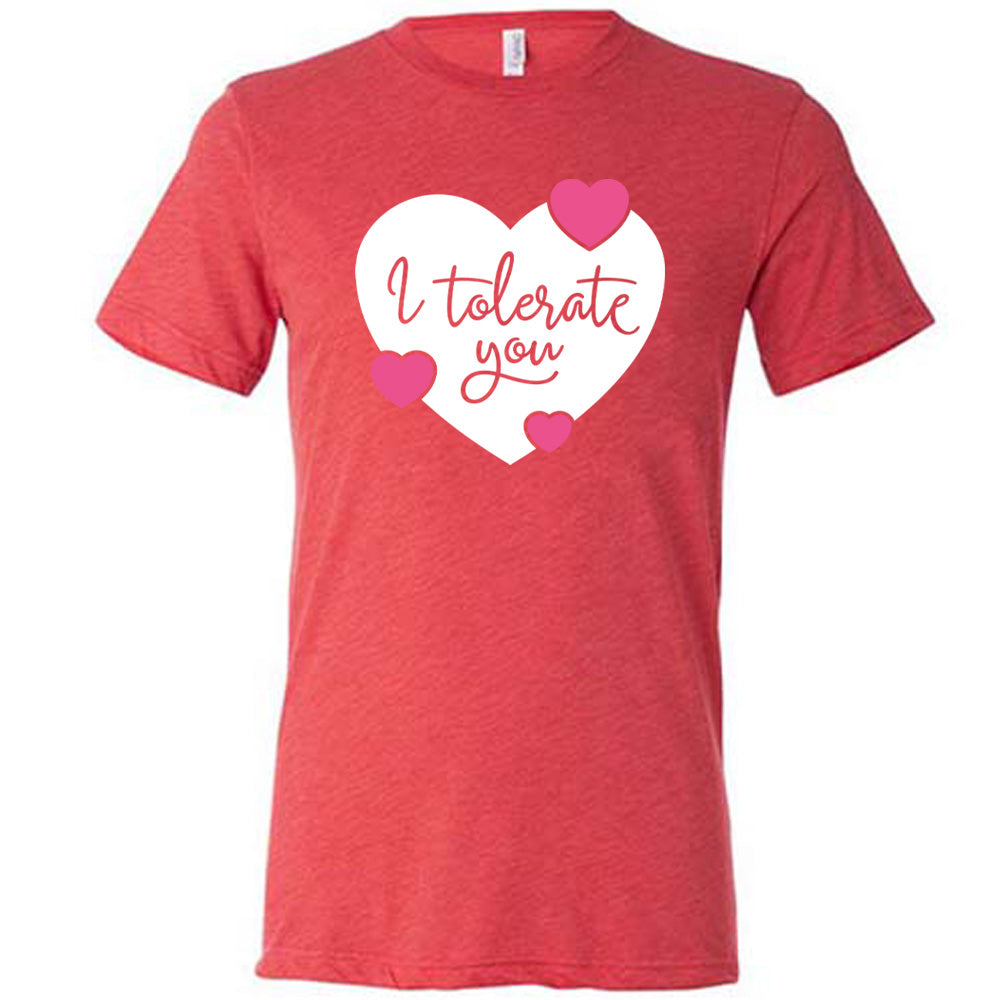red unisex tee with the words "I tolerate you" in red lettering on it, within a white heart graphic that has three small pink hearts overlapping on its edges 