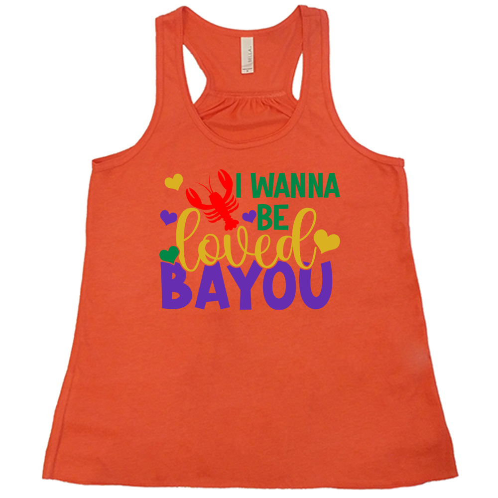 coral flowy tank with the words "I wanna be loved bayou" on it in varied fonts, with the small graphics a few hearts and one lobster