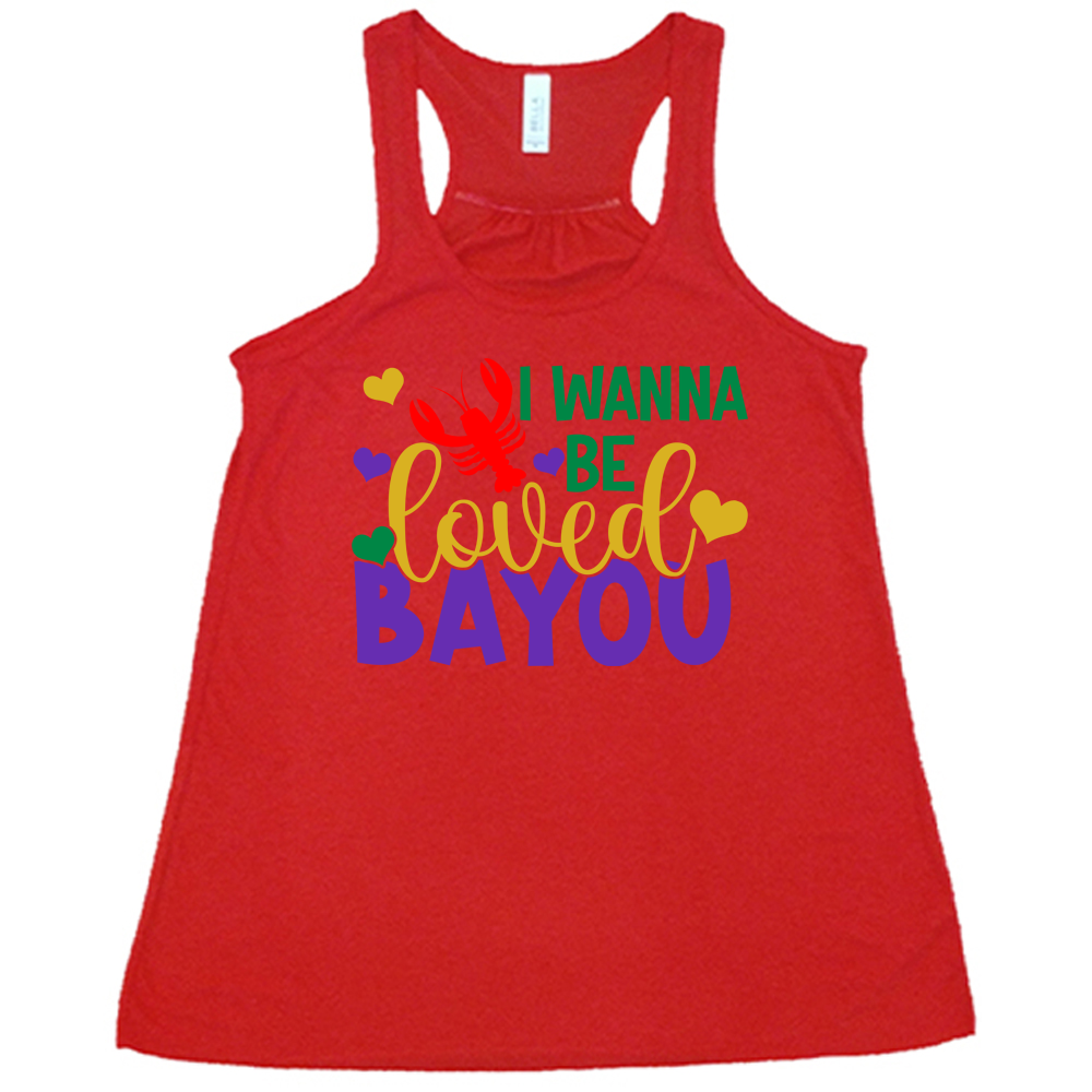red flowy tank with the words "I wanna be loved bayou" on it in varied fonts, with the small graphics a few hearts and one lobster