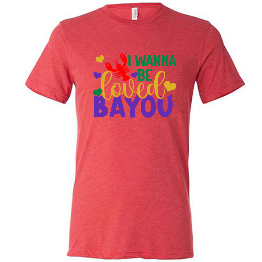 red unisex tee with the words "I wanna be loved bayou" on it in varied fonts, with the small graphics a few hearts and one lobster