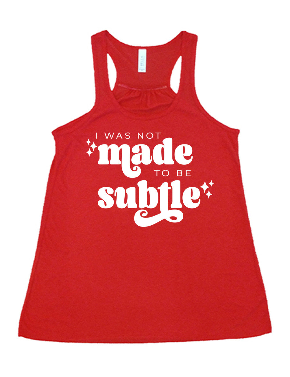 red flowy racerback tank with the words "I was not made to be subtle" on it, with a few stars embellishing