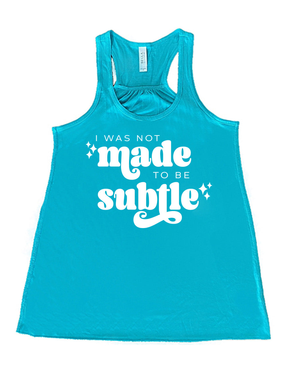 teal flowy racerback tank with the words "I was not made to be subtle" on it, with a few stars embellishing