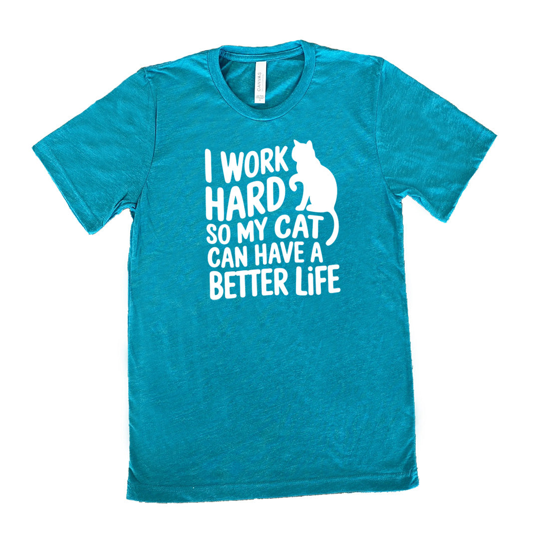 Teal colored shirt with cat silhouette graphic on it that says "I Work Hard So My Cat Can Have A Better Life"