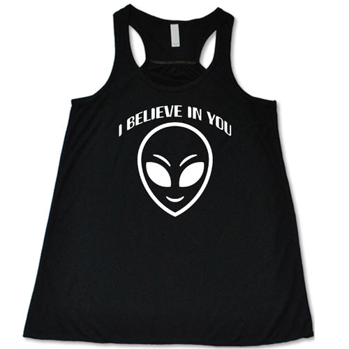 black racerback tank top with a "I believe in you" quote and alien head design on it